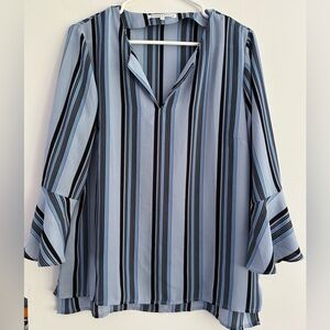 🩵 Light blue and black striped blouse.